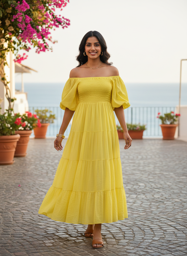 Sunshine Yellow Off-Shoulder Tiered Maxi Dress, front view. Model smiling, wearing a bright yellow dress with shirred bodice, puff sleeves, and tiered skirt, ideal for summer and resort wear.