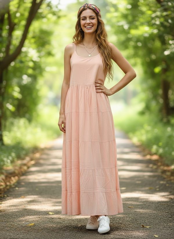 Woman in desert bloom peach tiered maxi dress, full front view, smiling on pathway