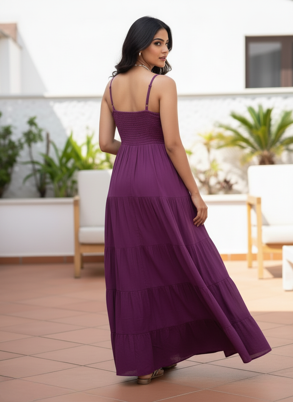 Woman in amethyst tiered maxi dress, back view with smocked detail
