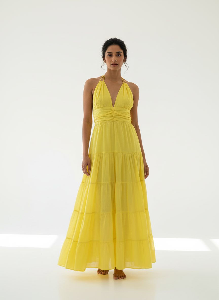 Woman in sunbeam yellow halter tiered maxi dress, full front view