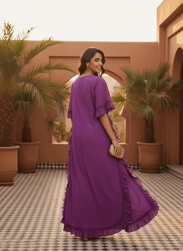 Back view of a flowy purple ruffle maxi dress perfect for resort wear.