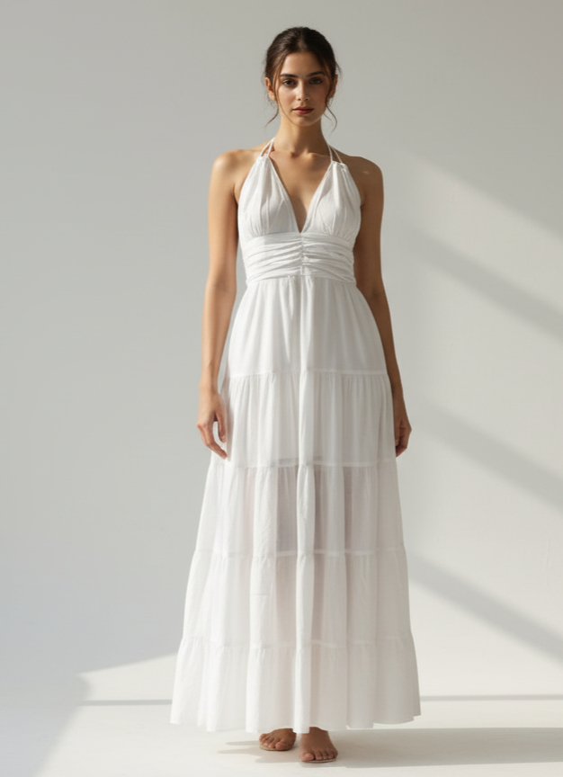 Woman in cloud nine white halter tiered maxi dress, full front view