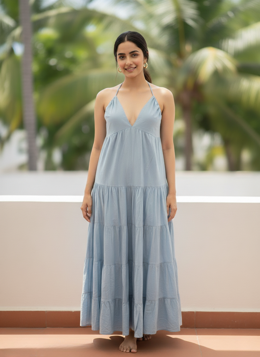 Woman in horizon dream light blue halter tiered maxi dress, full front view, smiling