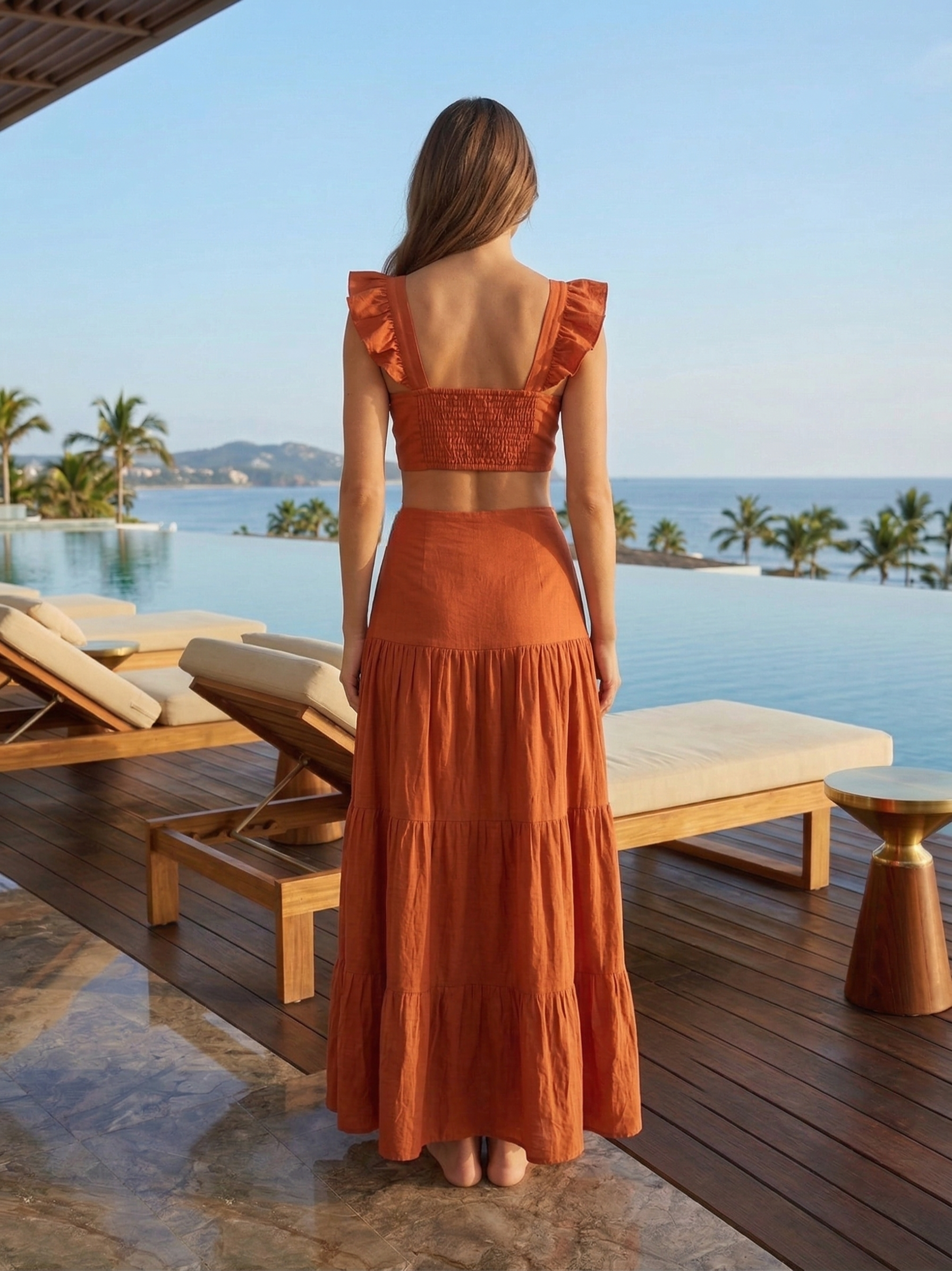 Back view of cotton co-ord set with ruched elastic crop top and high waist maxi skirt in rust orange